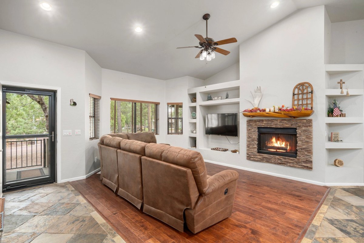 The cabin living area with a fireplace and sofa
