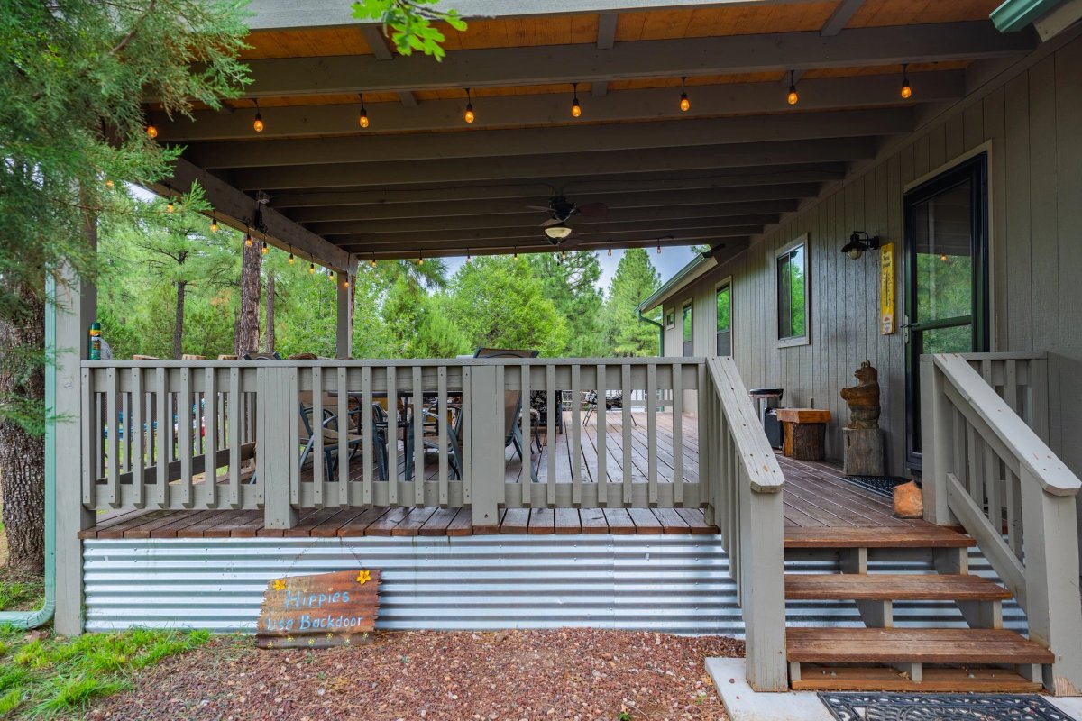 The cabin porch surrounded by Ponderosa pine branches